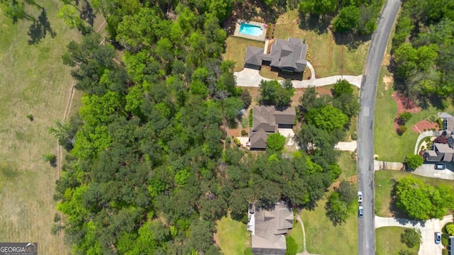 aerial view featuring a view of trees