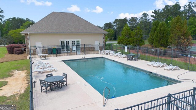 birds eye view of property featuring a view of trees