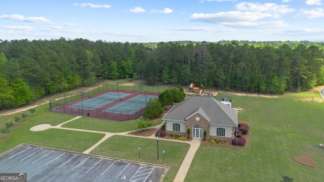 drone / aerial view featuring a view of trees