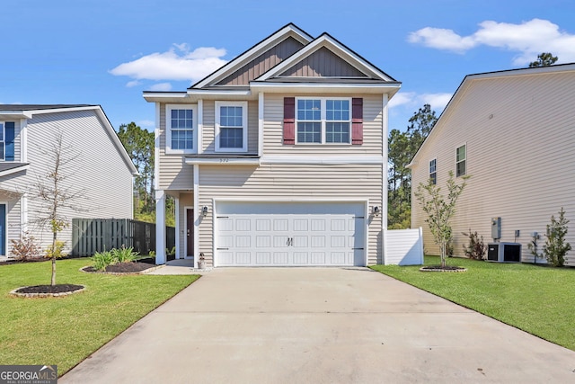 572 Brightleaf Cir, Hinesville, GA 31313 - view of front facade featuring board and batten siding, fence, a front lawn, an attached garage, and driveway