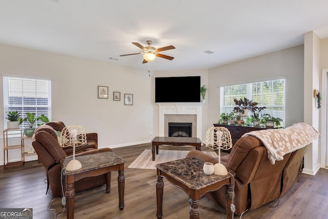 572 Brightleaf Cir, Hinesville, GA 31313 - living room featuring dark wood-type flooring, ceiling fan, a fireplace, and baseboards