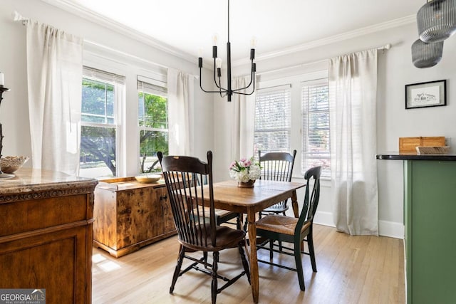812 E Ponce De Leon Ave, Decatur, GA 30030 - dining area featuring light wood-type flooring, crown molding, and a chandelier