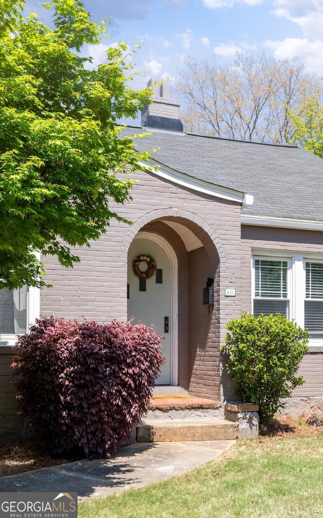 812 E Ponce De Leon Ave, Decatur, GA 30030 - entrance to property with a chimney and brick siding