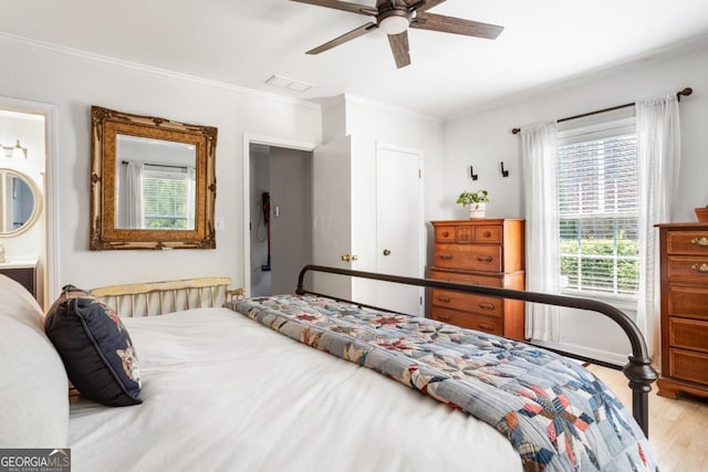 812 E Ponce De Leon Ave, Decatur, GA 30030 - bedroom with wood finished floors, crown molding, a ceiling fan, and ensuite bath