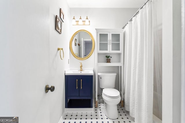 812 E Ponce De Leon Ave, Decatur, GA 30030 - bathroom with vanity, baseboards, toilet, and a shower with shower curtain