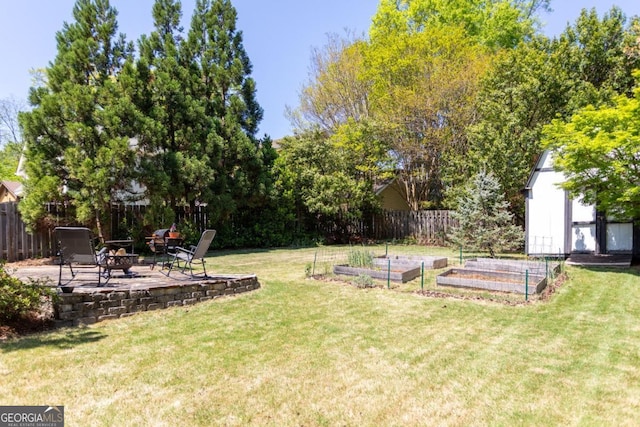 812 E Ponce De Leon Ave, Decatur, GA 30030 - view of yard featuring a garden, an outdoor fire pit, a patio, and a shed
