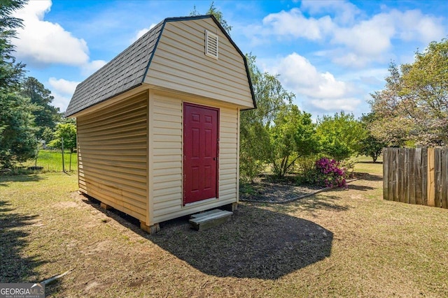 view of shed with fence
