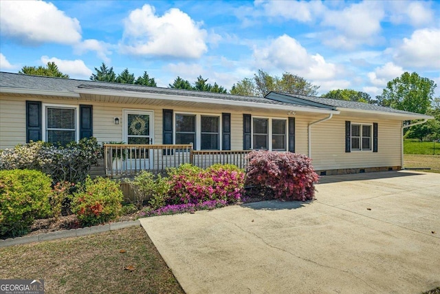 view of front of home with covered porch and crawl space