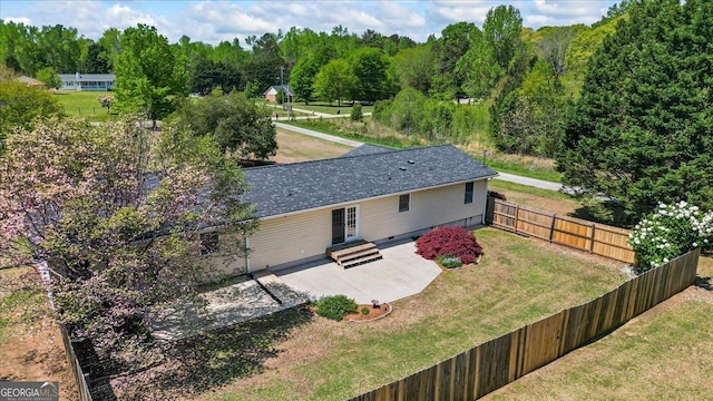 drone / aerial view featuring a view of trees