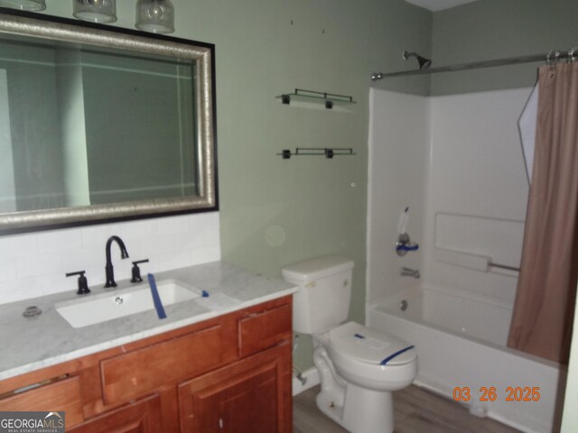 2338 Rambling Way, Lithonia, GA 30058 - full bath featuring toilet, shower / bath combo, vanity, and backsplash