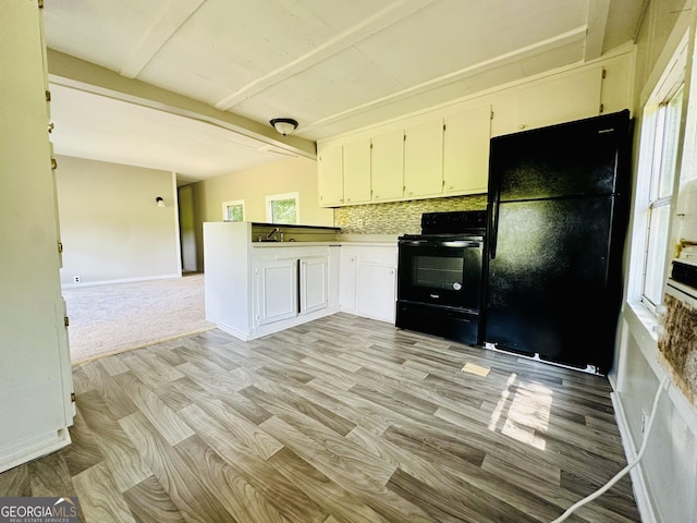 4199 Wagon Trl, Loganville, GA 30052 - kitchen featuring tasteful backsplash, baseboards, open floor plan, beam ceiling, and black appliances