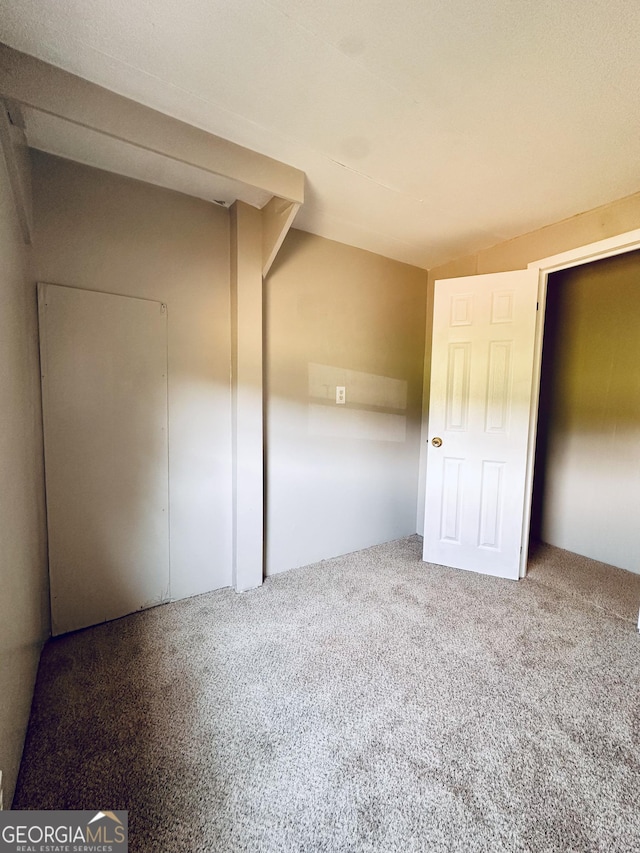 4199 Wagon Trl, Loganville, GA 30052 - unfurnished bedroom with carpet flooring and lofted ceiling