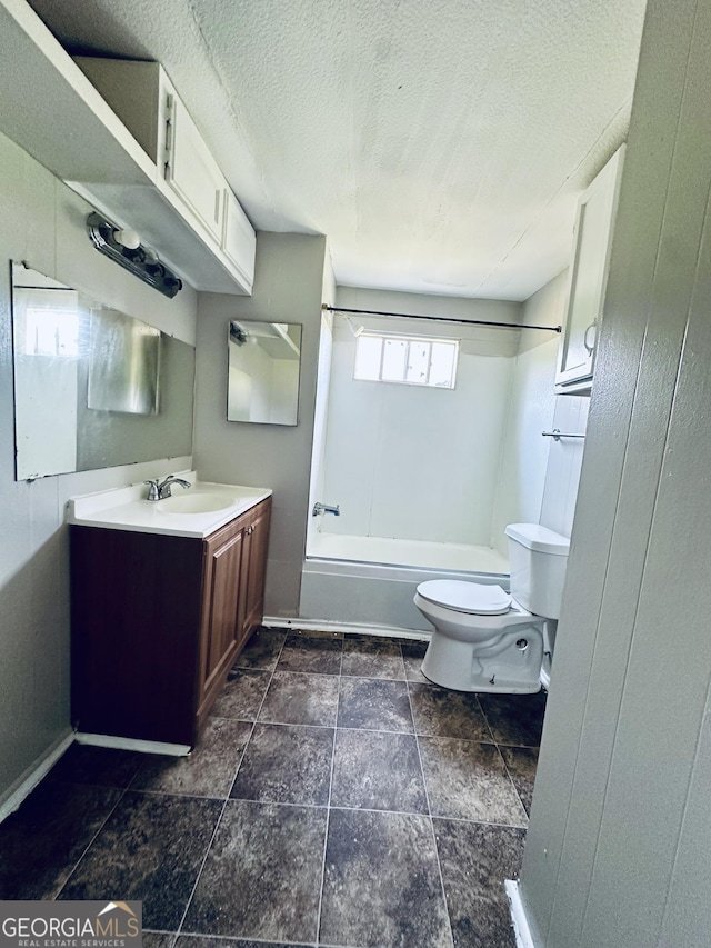 4199 Wagon Trl, Loganville, GA 30052 - full bathroom featuring baseboards, toilet, a textured ceiling, shower / bath combination, and vanity
