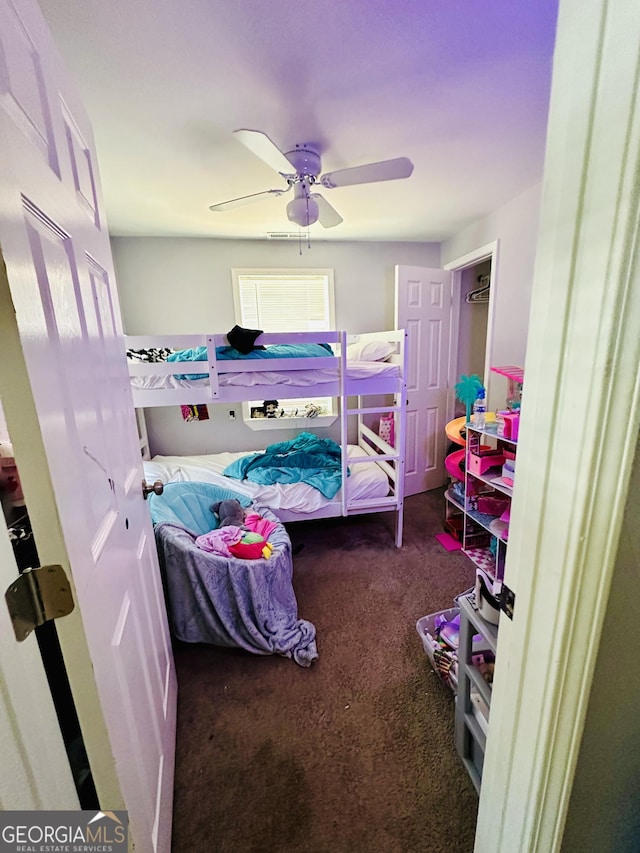 bedroom with carpet flooring and a ceiling fan