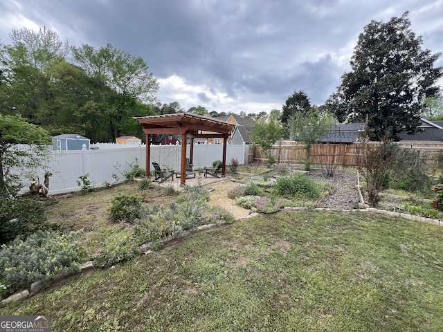 view of yard featuring a patio, a fenced backyard, and a pergola