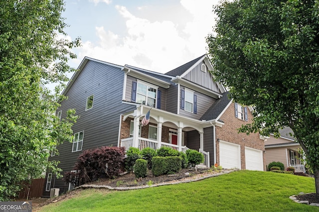 67 Ryans Pt, Dallas, GA 30132 - craftsman inspired home featuring board and batten siding, covered porch, a front yard, and brick siding