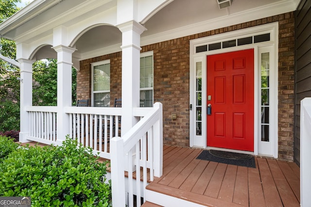 67 Ryans Pt, Dallas, GA 30132 - doorway to property featuring brick siding and a porch
