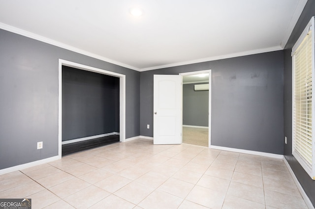 67 Ryans Pt, Dallas, GA 30132 - unfurnished bedroom with light tile patterned floors, baseboards, a wall unit AC, and ornamental molding