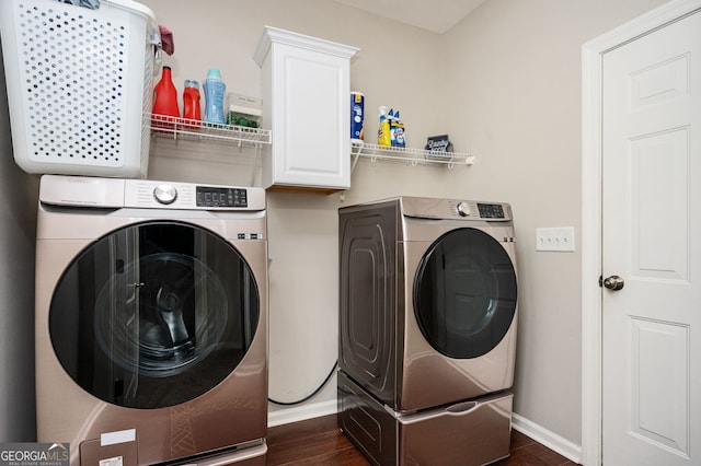 67 Ryans Pt, Dallas, GA 30132 - washroom featuring cabinet space, separate washer and dryer, and dark wood-style flooring