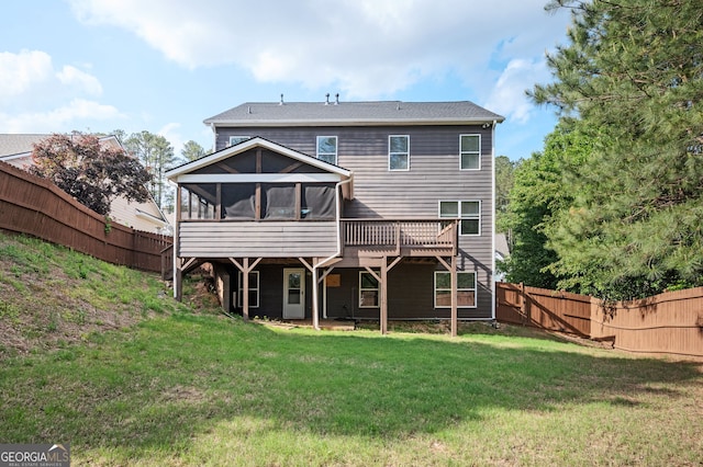 67 Ryans Pt, Dallas, GA 30132 - back of property featuring a wooden deck, a sunroom, a fenced backyard, and a lawn