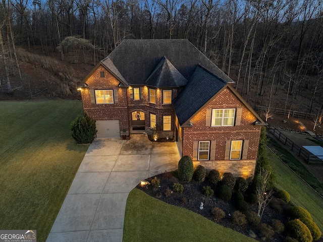 4538 Sterling Pointe Dr NW, Kennesaw, GA 30152 - traditional-style house with a front yard, brick siding, driveway, a garage, and roof with shingles