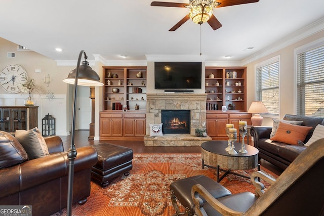 4538 Sterling Pointe Dr NW, Kennesaw, GA 30152 - living room featuring a ceiling fan, ornamental molding, a stone fireplace, and wood finished floors