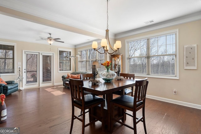 4538 Sterling Pointe Dr NW, Kennesaw, GA 30152 - dining area with baseboards, dark wood-type flooring, a chandelier, healthy amount of natural light, and ornamental molding