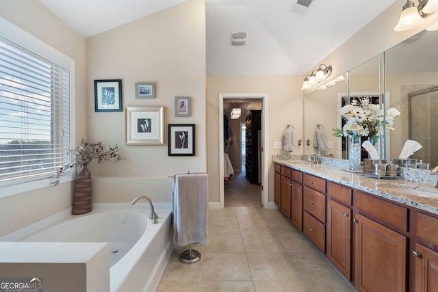 4538 Sterling Pointe Dr NW, Kennesaw, GA 30152 - bathroom with healthy amount of natural light, double vanity, a bath, tile patterned floors, and lofted ceiling
