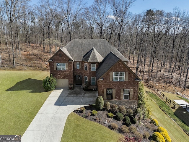 4538 Sterling Pointe Dr NW, Kennesaw, GA 30152 - view of front of property featuring driveway, brick siding, a garage, and roof with shingles