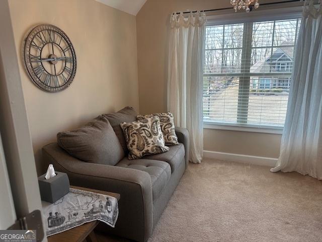 4538 Sterling Pointe Dr NW, Kennesaw, GA 30152 - living area featuring healthy amount of natural light, vaulted ceiling, carpet flooring, and baseboards