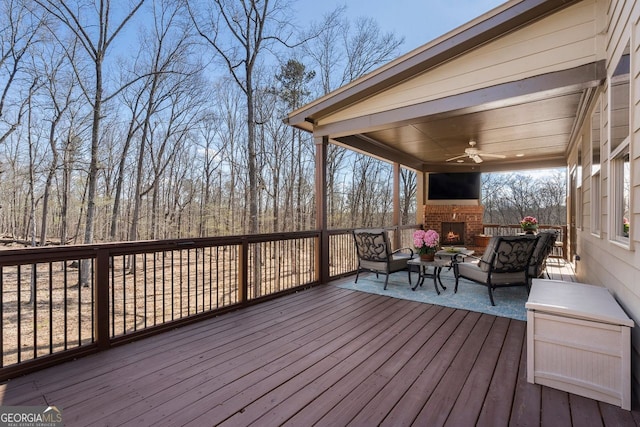 4538 Sterling Pointe Dr NW, Kennesaw, GA 30152 - wooden terrace with an outdoor living space with a fireplace and ceiling fan