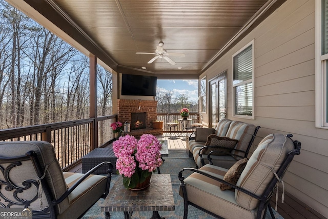 4538 Sterling Pointe Dr NW, Kennesaw, GA 30152 - wooden terrace featuring an outdoor living space with a fireplace, a ceiling fan, and outdoor dining area