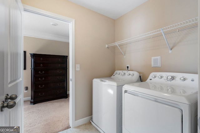 4538 Sterling Pointe Dr NW, Kennesaw, GA 30152 - laundry room featuring washing machine and dryer, light colored carpet, baseboards, and crown molding