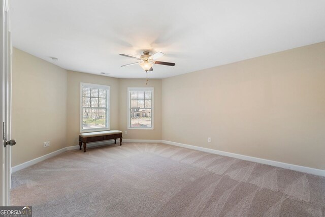 4538 Sterling Pointe Dr NW, Kennesaw, GA 30152 - spare room with a ceiling fan, baseboards, and light carpet