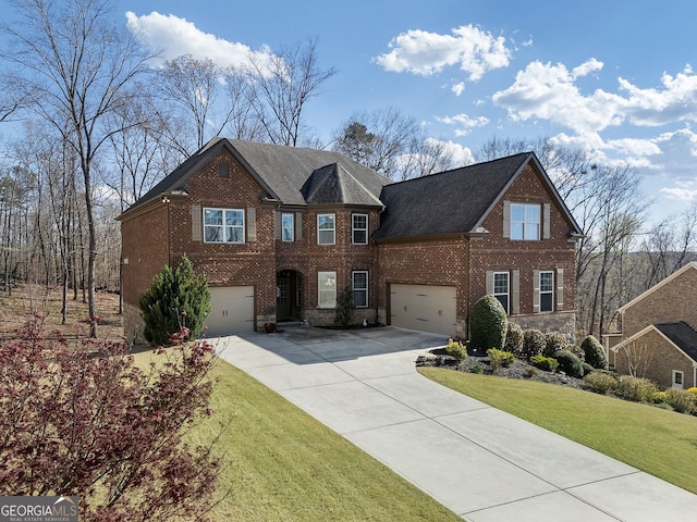 4538 Sterling Pointe Dr NW, Kennesaw, GA 30152 - view of front of property featuring brick siding, driveway, a front yard, and an attached garage