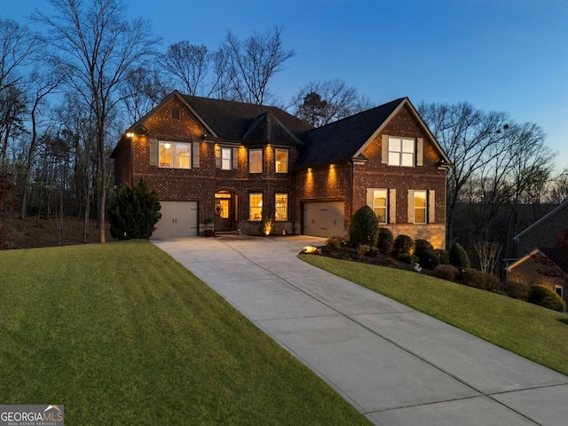 4538 Sterling Pointe Dr NW, Kennesaw, GA 30152 - traditional-style home with driveway, brick siding, a front lawn, and a garage