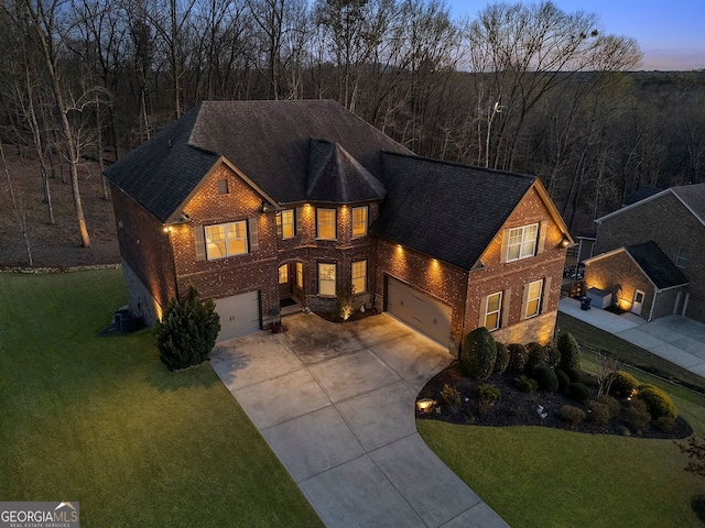 4538 Sterling Pointe Dr NW, Kennesaw, GA 30152 - view of front of property with brick siding, an attached garage, driveway, and a front lawn