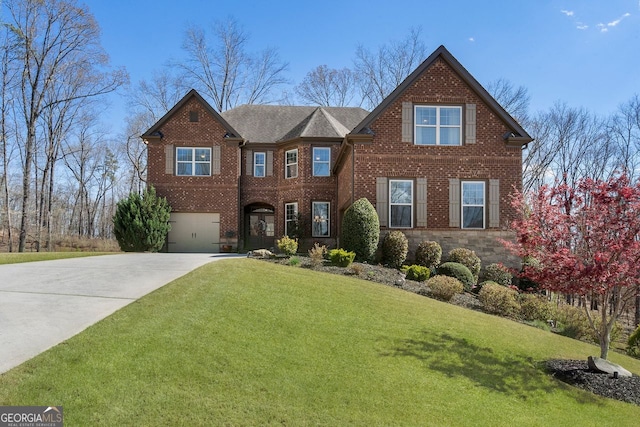 4538 Sterling Pointe Dr NW, Kennesaw, GA 30152 - view of front facade featuring driveway, a garage, brick siding, and a front yard