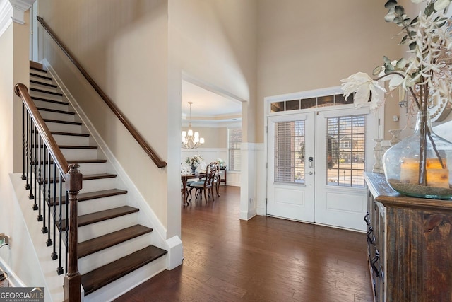 4538 Sterling Pointe Dr NW, Kennesaw, GA 30152 - foyer entrance with stairs, a high ceiling, dark wood-type flooring, a chandelier, and french doors