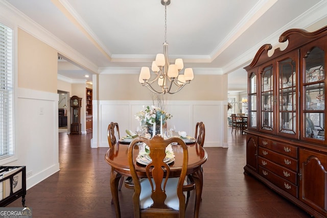 4538 Sterling Pointe Dr NW, Kennesaw, GA 30152 - dining area featuring a chandelier, a raised ceiling, dark wood-style floors, wainscoting, and ornamental molding