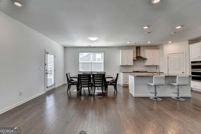 5530 Bower Pl, Cumming, GA 30028 - dining space with dark wood-style flooring, baseboards, and recessed lighting