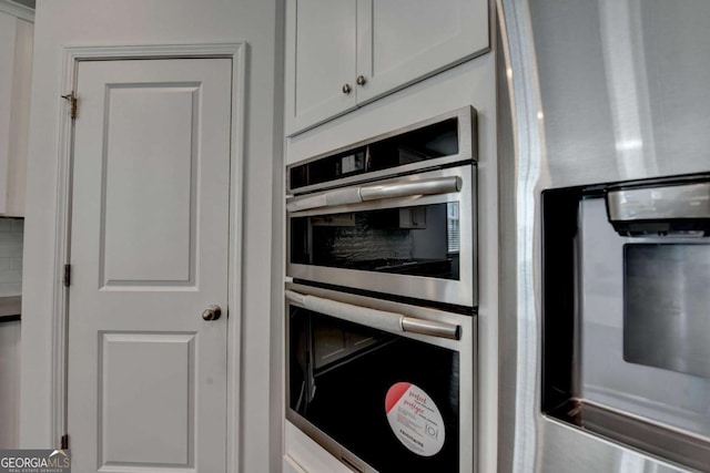 5530 Bower Pl, Cumming, GA 30028 - kitchen with stainless steel appliances and white cabinets