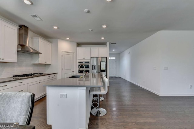 5530 Bower Pl, Cumming, GA 30028 - kitchen with wall chimney exhaust hood, appliances with stainless steel finishes, a sink, decorative backsplash, and baseboards