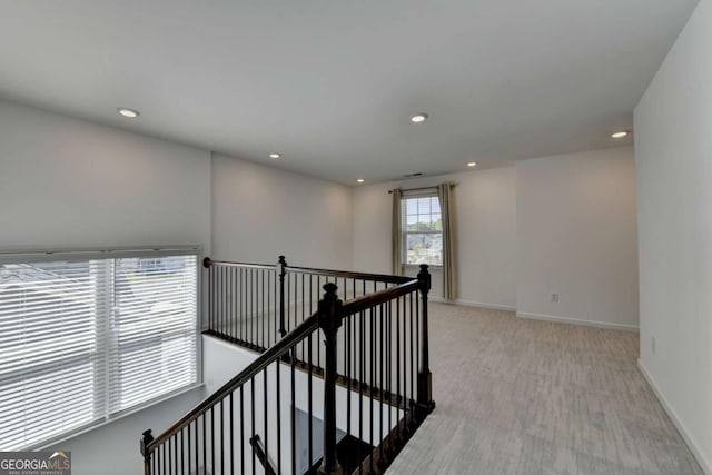 5530 Bower Pl, Cumming, GA 30028 - hallway with baseboards, an upstairs landing, recessed lighting, and light carpet
