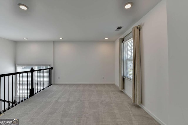 5530 Bower Pl, Cumming, GA 30028 - empty room with visible vents, baseboards, recessed lighting, and light colored carpet