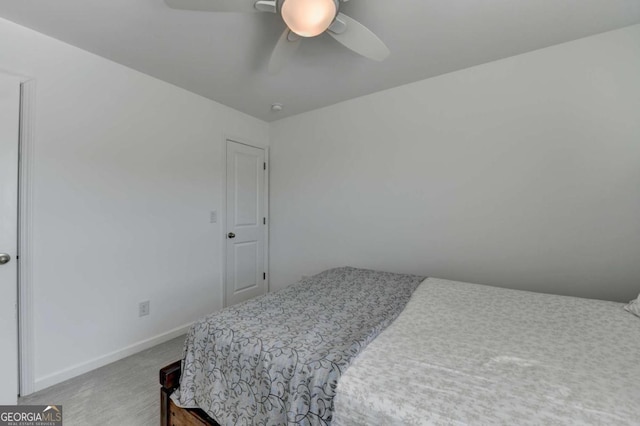5530 Bower Pl, Cumming, GA 30028 - carpeted bedroom featuring baseboards and a ceiling fan