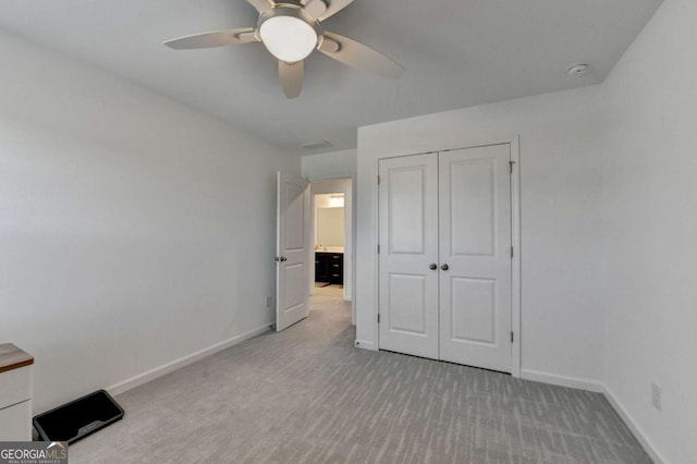 5530 Bower Pl, Cumming, GA 30028 - unfurnished bedroom with a closet, baseboards, carpet flooring, and ceiling fan
