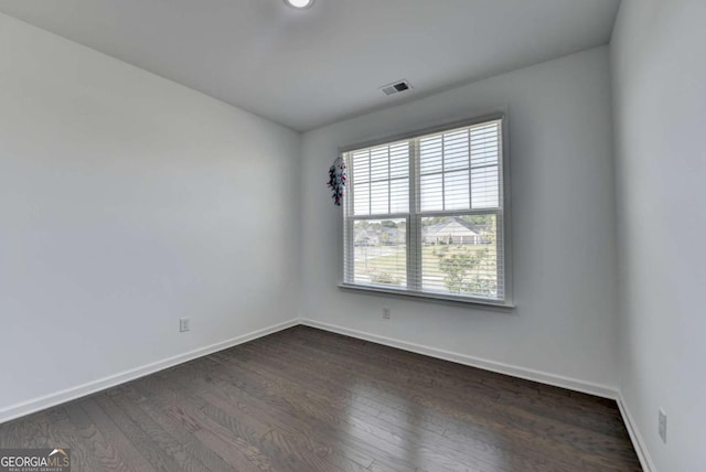 5530 Bower Pl, Cumming, GA 30028 - empty room with dark wood-style floors, baseboards, and visible vents