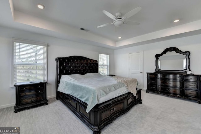 5530 Bower Pl, Cumming, GA 30028 - carpeted bedroom featuring a tray ceiling, baseboards, recessed lighting, and visible vents