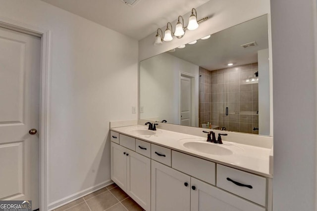5530 Bower Pl, Cumming, GA 30028 - bathroom with a sink, tile patterned floors, a stall shower, and baseboards